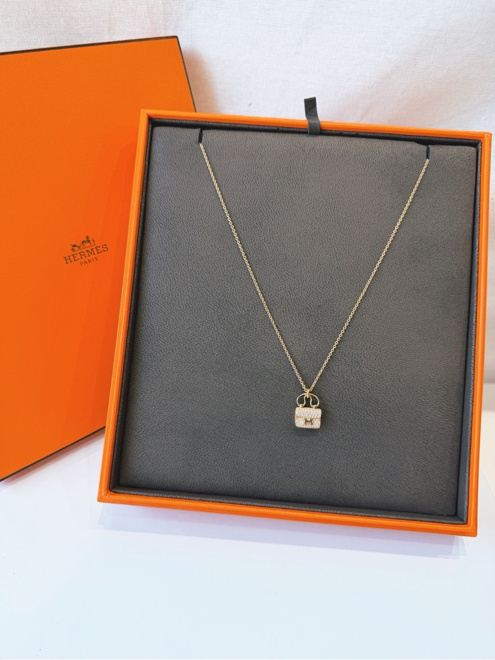Hermes Amulettes Constance pendant necklace